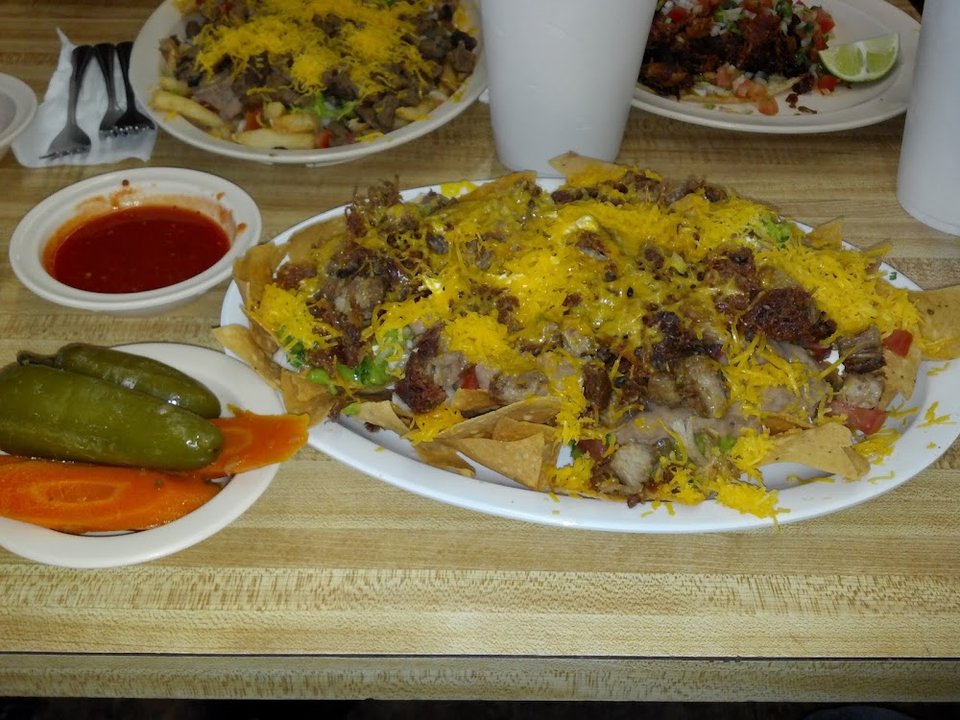 Restaurant menu layout with categories and dish names.