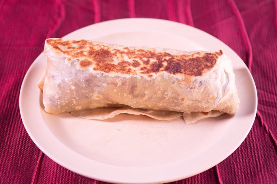 Close-up of a menu listing quesadillas and nachos.