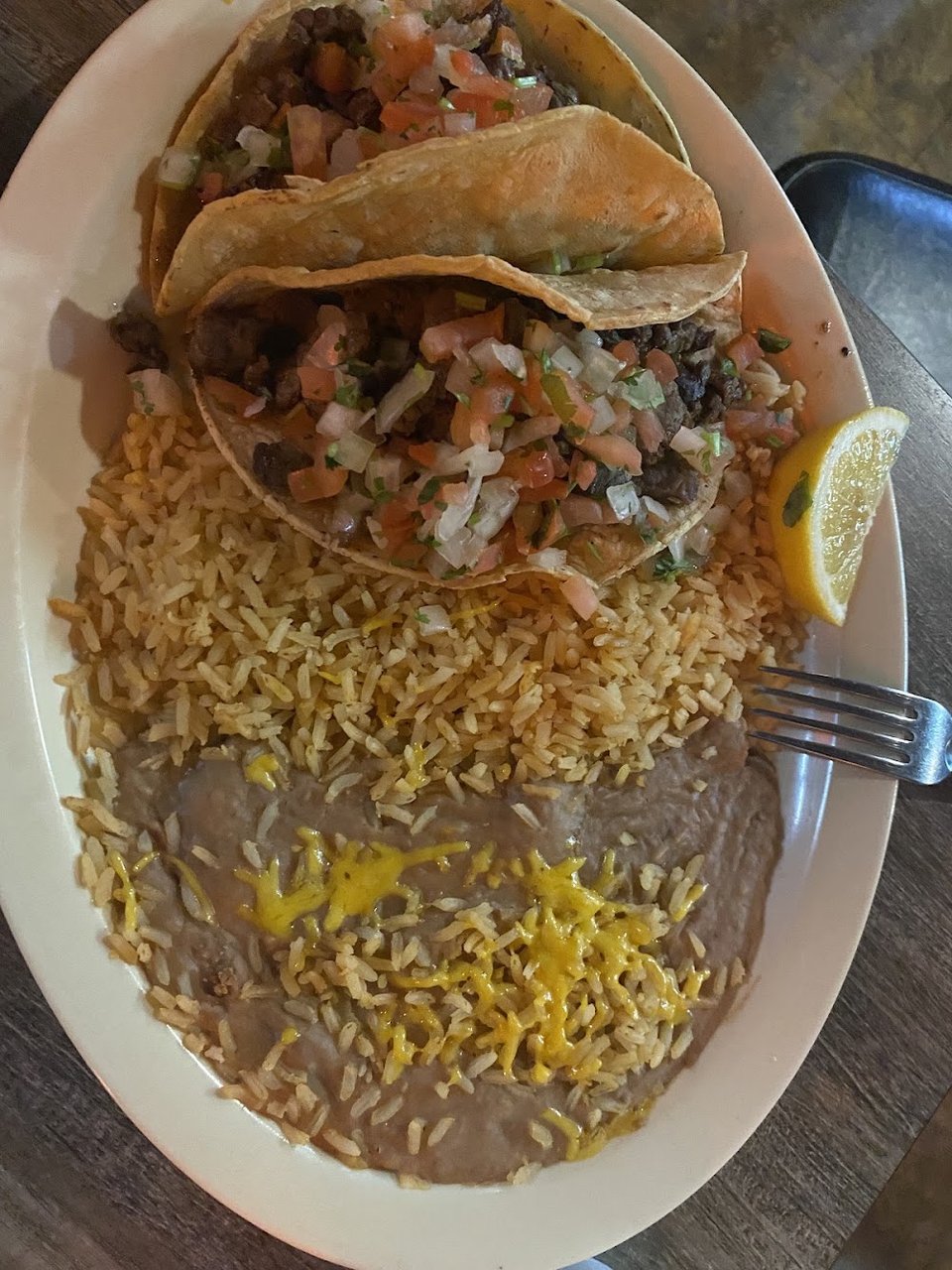 Close-up of a menu listing quesadillas and nachos.